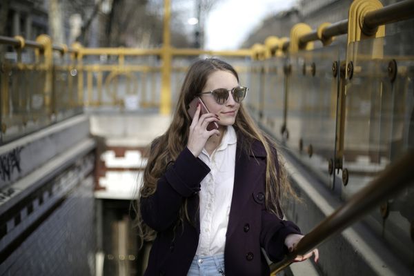 Hotel guest communicating via cellphone